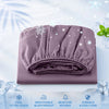 A purple cooling fitted sheet folded on a white surface with ice crystals and snowflake graphics.