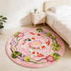 Round rug featuring a pink background with colorful koi fish and green leaves.