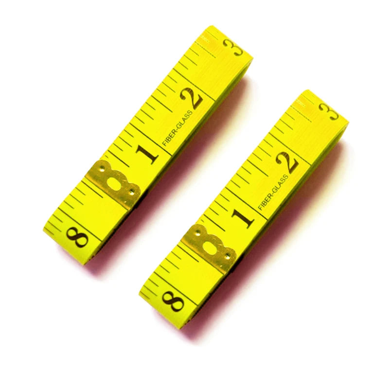 A set of two yellow fiberglass measuring tapes laid diagonally on a white background.