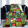 A colorful Christmas themed plush coral fleece throw blanket featuring festive characters and holiday text.