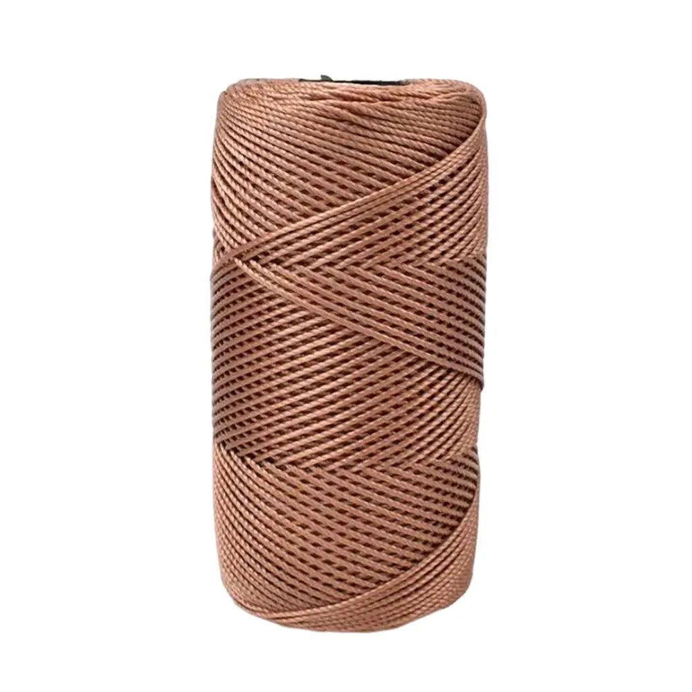 A spool of brown cotton silk thread used for knitting and crafting.