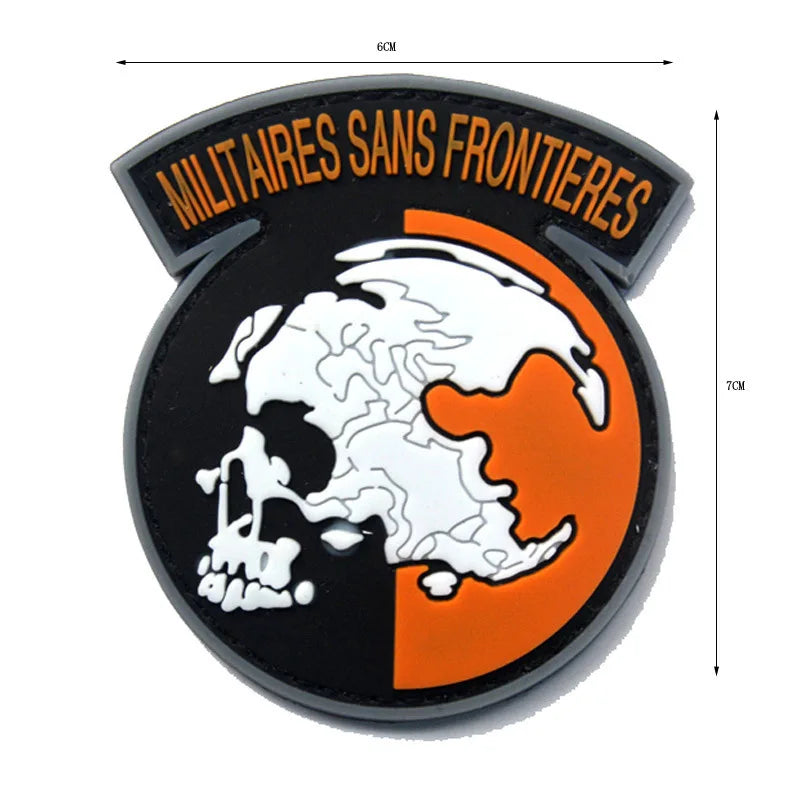 A round black badge featuring a white skull silhouette of a foxhound head and orange background with yellow text.