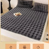 Gray faux fur decorative pillow covers used as winter warmth and plaid accents.