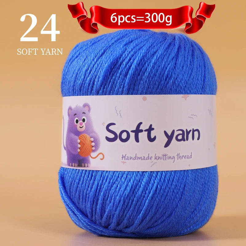 A skein of 24 soft blue yarn, labeled as handmade knitting thread, is shown on a light background.