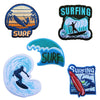 A collection of embroidered patches featuring surfing and wave designs in various styles and colors.