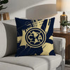 A navy blue decorative pillow featuring a gold map of North America and the letters CA.