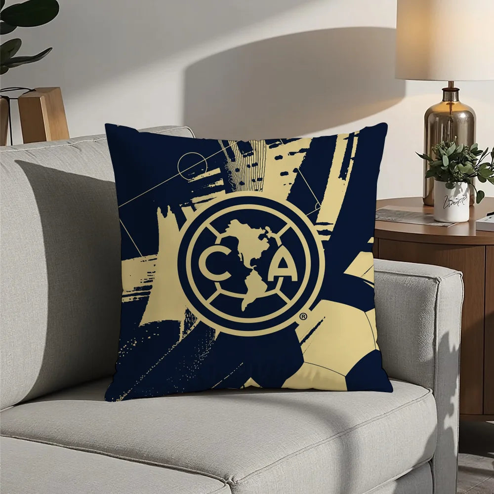 A navy blue decorative pillow featuring a gold map of North America and the letters CA.