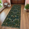 A long vintage botanical runner rug featuring dark green foliage and floral patterns on a light wood floor.