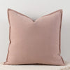 A solid blush pink chenille throw pillow cover with a subtle vertical texture.
