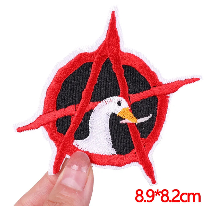 Red embroidered patch featuring a white seagull design on a black background