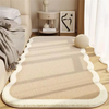 A beige seasonal decor rug with striped shadows lies on a light wood floor next to a sofa and a side table.