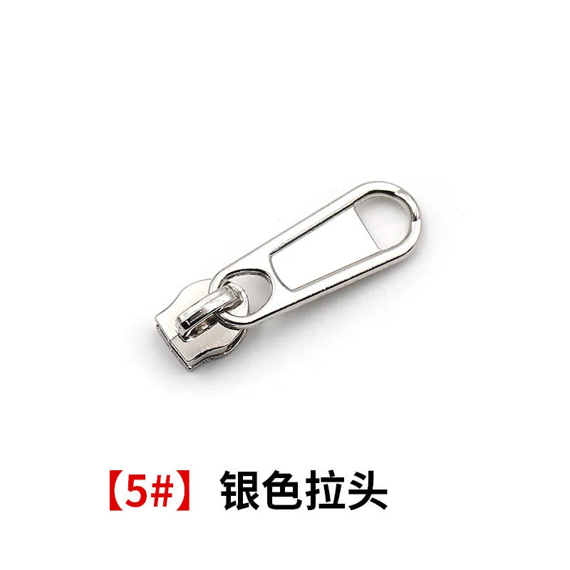 A silver universal zipper repair kit featuring a replacement slider component.