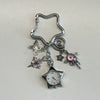 Silver star-shaped pocket watch keychain featuring an adjustable clock and a butterfly charm.