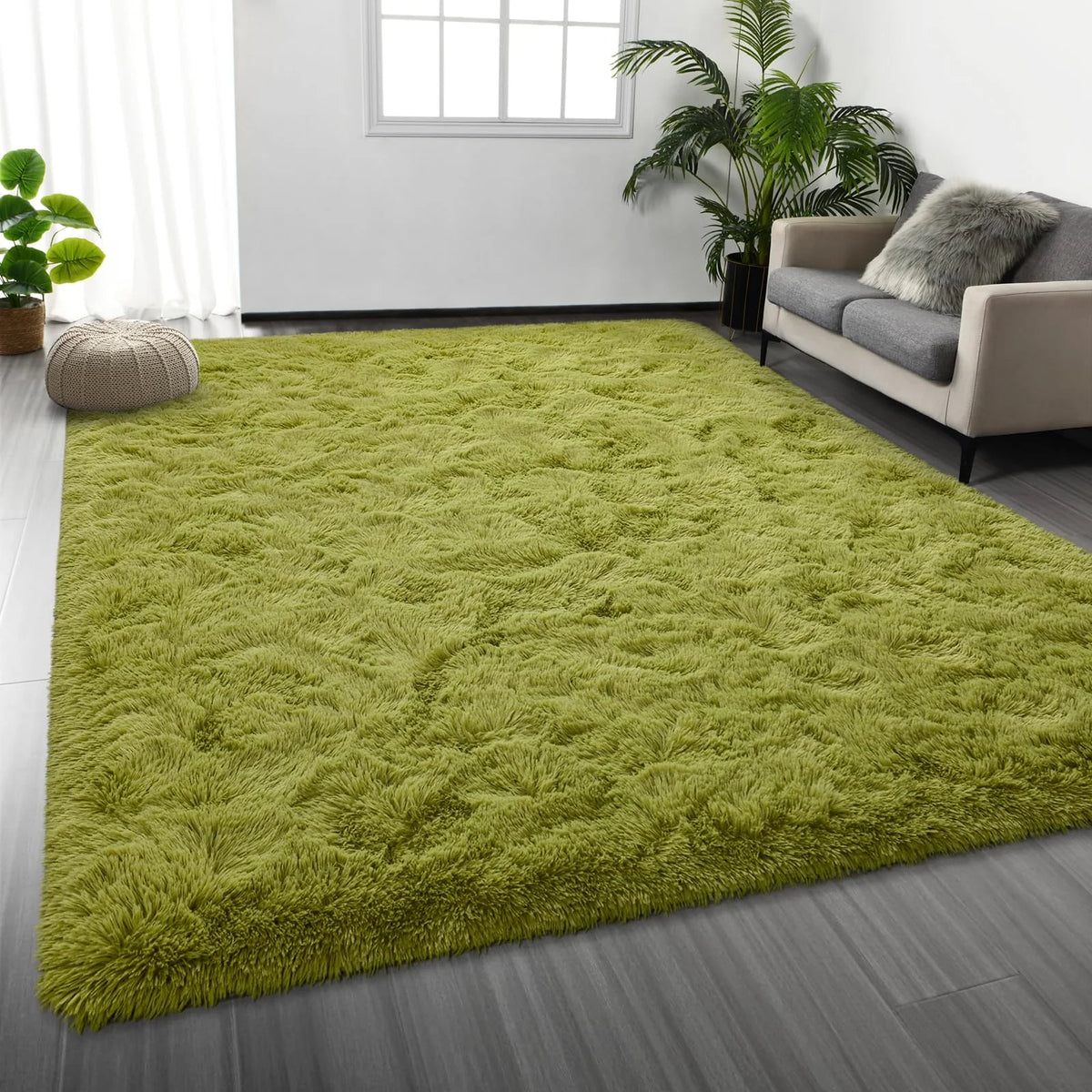 A bright lime green shaggy rug placed on a gray wooden floor in a modern living room setting.