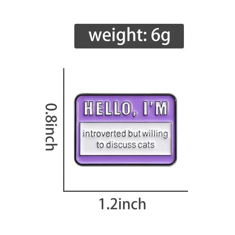 A purple enamel lapel pin shaped like an airline ticket with the text HELLO I'M introverted but willing to discuss cats