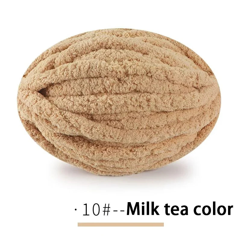 A ball of extra thick hand-knitted yarn in a milk tea color.