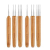 A set of five wooden crochet hooks for dreadlocks and braids