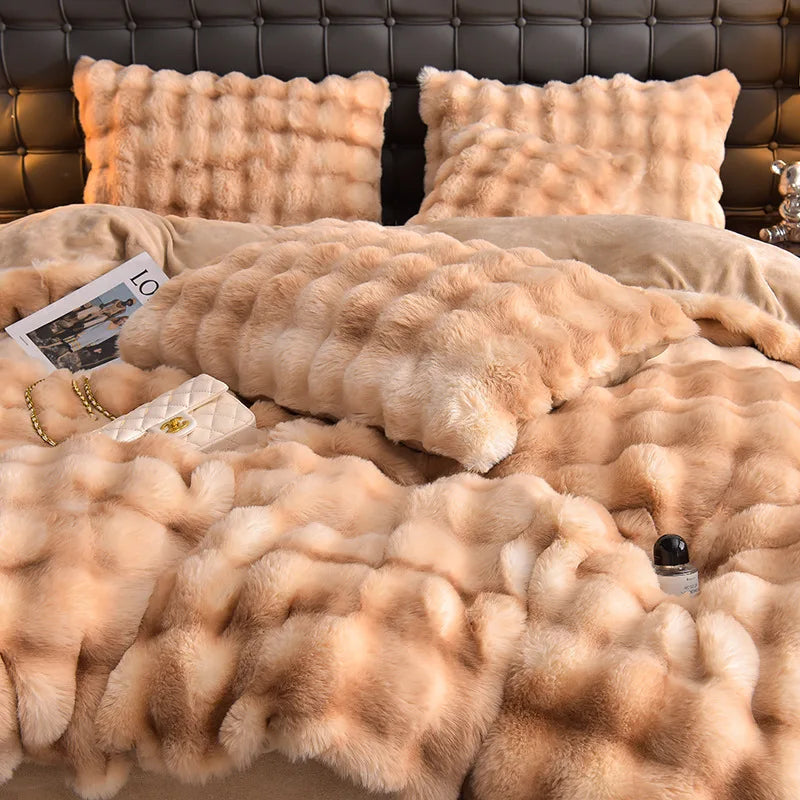 A luxurious beige plush rabbit hair bedding set featuring fluffy pillows and a thick blanket.