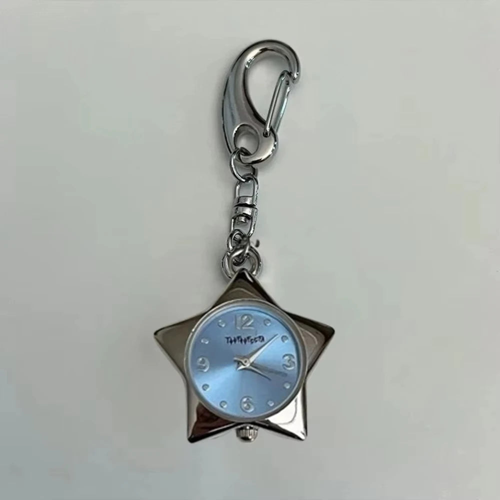 Silver star-shaped pocket watch keychain with a light blue face and silver chain.