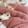 A red and white plaid duvet cover set featuring lace embroidery on a white background.