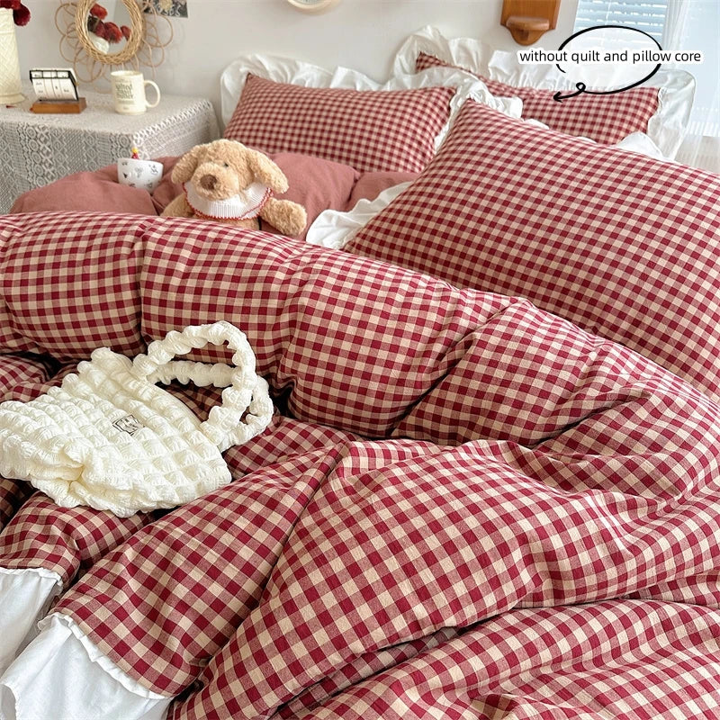 A red and white plaid duvet cover set featuring lace embroidery on a white background.