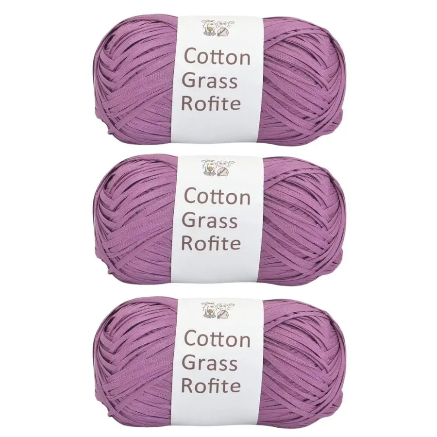 Three skeins of purple cotton grass roving yarn labeled Cotton Grass Rofite