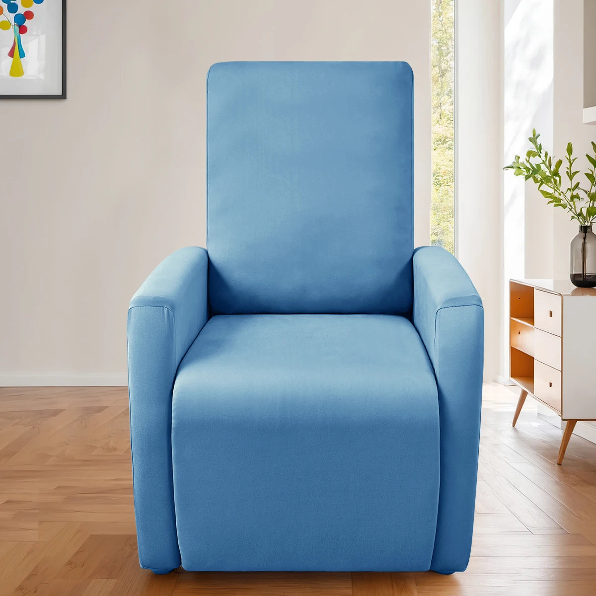 A light blue milk silk stretch sofa cover set for accent chairs displayed in a bright room.