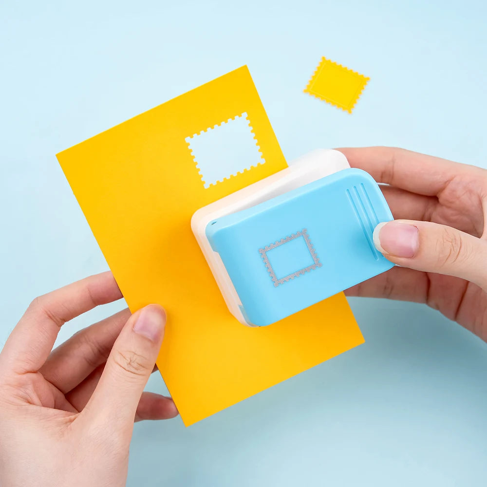 A hand holds a yellow card with a white embossed pattern and a light blue tool for precision embossing and punching.