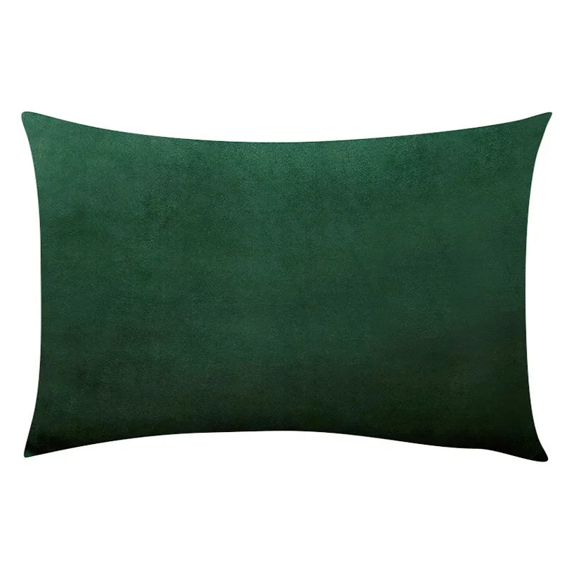 A dark emerald green velvet throw pillow cover.