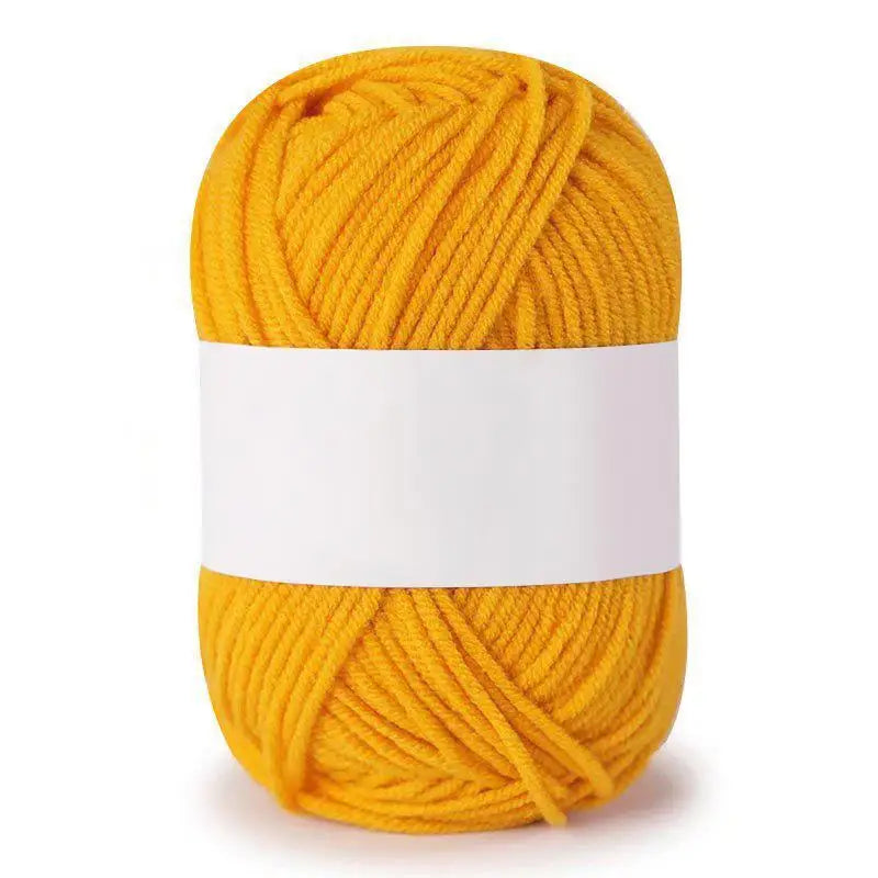 A ball of bright yellow soft milk cotton knitting yarn