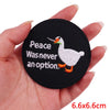 Black embroidered patch featuring a white duck with text that reads Peace Was never an option