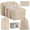 A set of beige travel storage organizers including a large box, smaller boxes, and a drawstring bag.