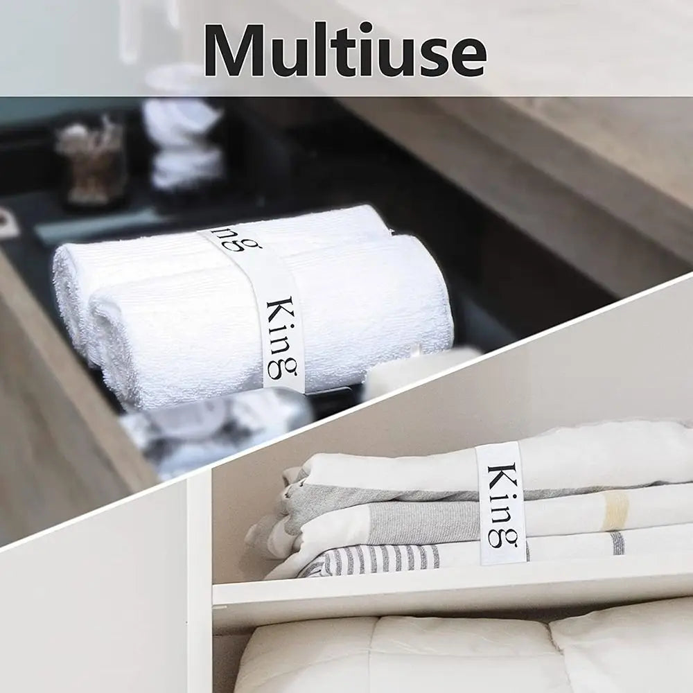 A close-up of white towels with King size straps organized in a storage compartment.