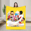 A yellow throw blanket featuring an illustration of characters from a cartoon in a cloud setting.