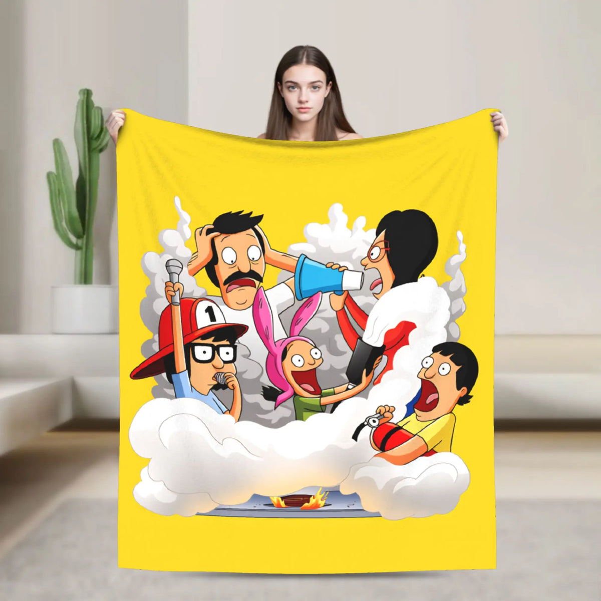 A yellow throw blanket featuring an illustration of characters from a cartoon in a cloud setting.