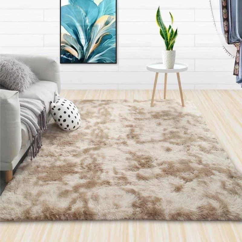 A fluffy beige luxury velvet anti-slip floor mat placed on a light wooden floor.