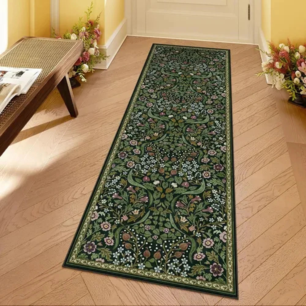 A long runner rug featuring a dense botanical pattern in shades of green, pink, and white on a light wood floor.