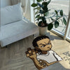A cartoon character shaped floor rug depicting a fierce-looking figure on a light wood floor.