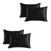 A set of two black satin silk pillowcases.