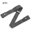 A grey invisible stretch belt for pants and dresses shown flat.