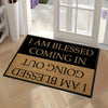 A black and tan doormat with the text I am blessed coming in going out and I am blessed.