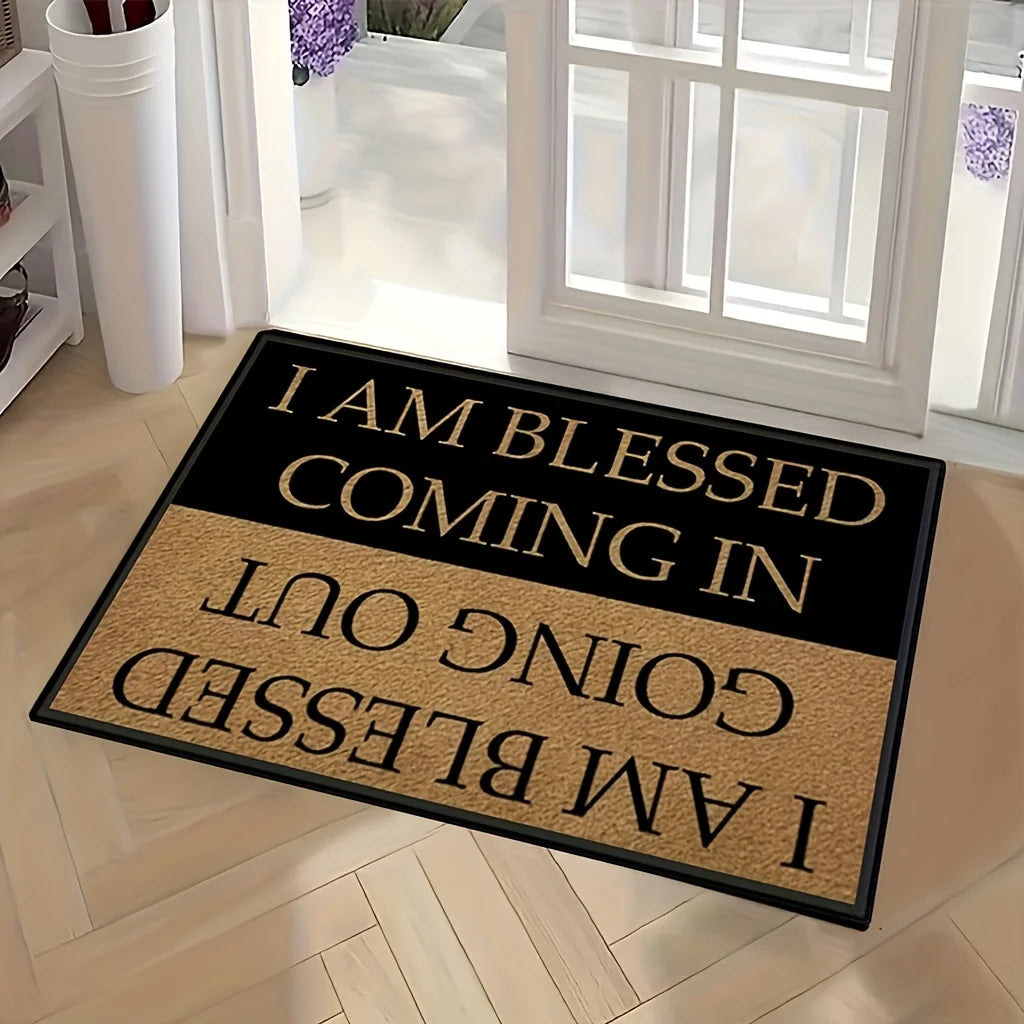 A black and tan doormat with the text I am blessed coming in going out and I am blessed.