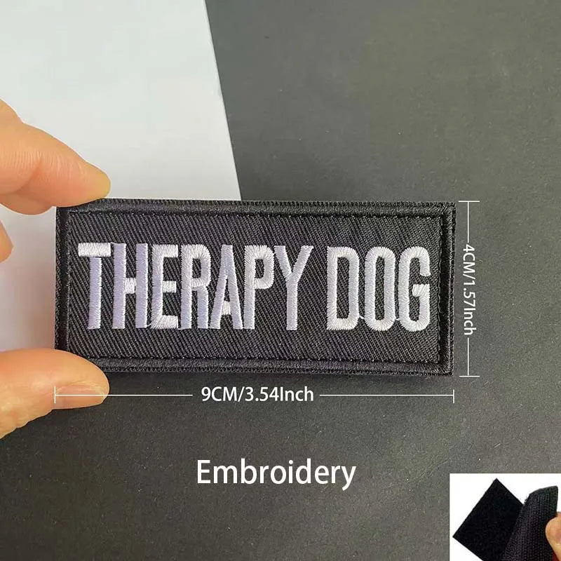 Black embroidered patch with white text Therapy Dog measuring 9cm or 3.54inch wide