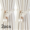 Two sets of white artificial pearl curtain tie-backs with gold accents