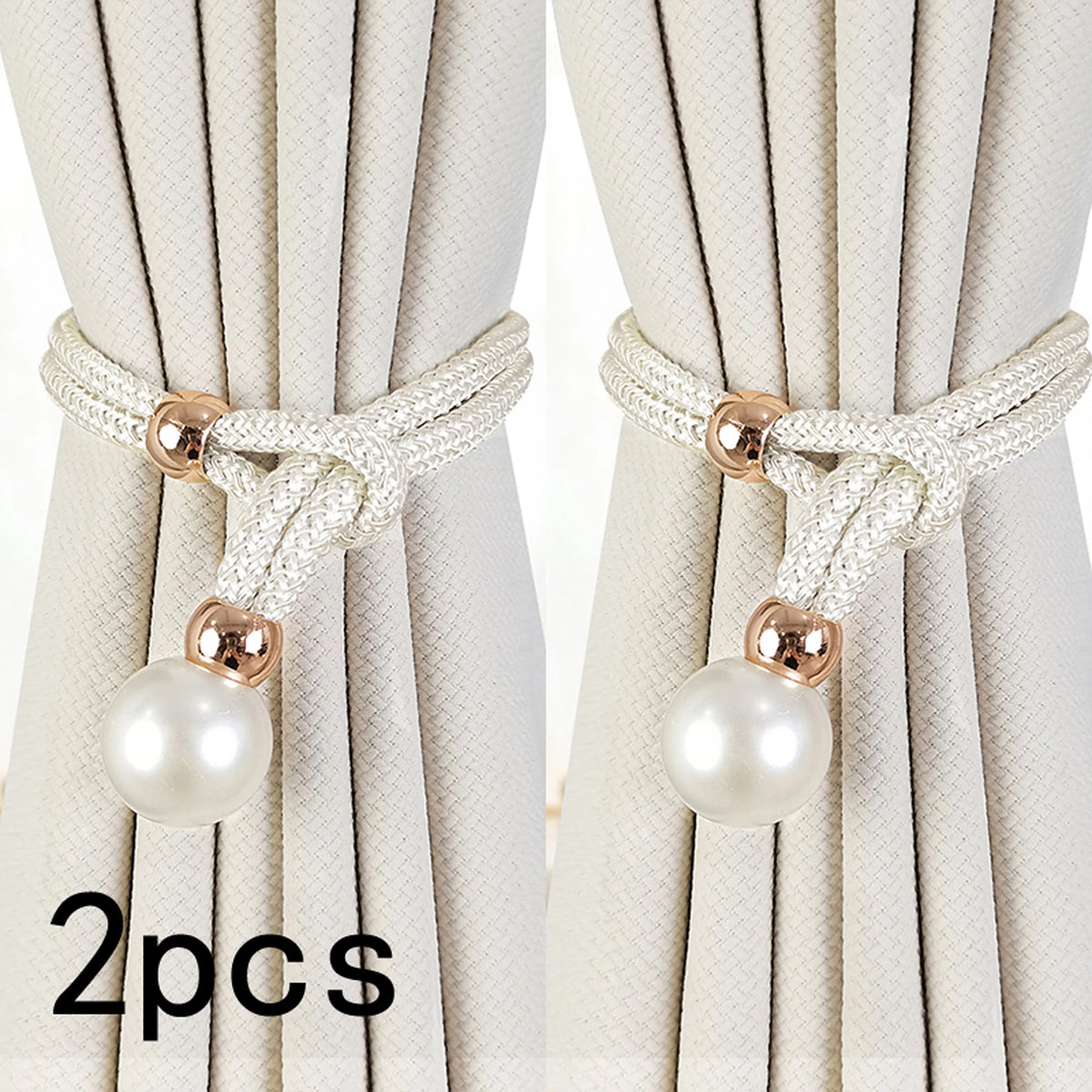 Two sets of white artificial pearl curtain tie-backs with gold accents