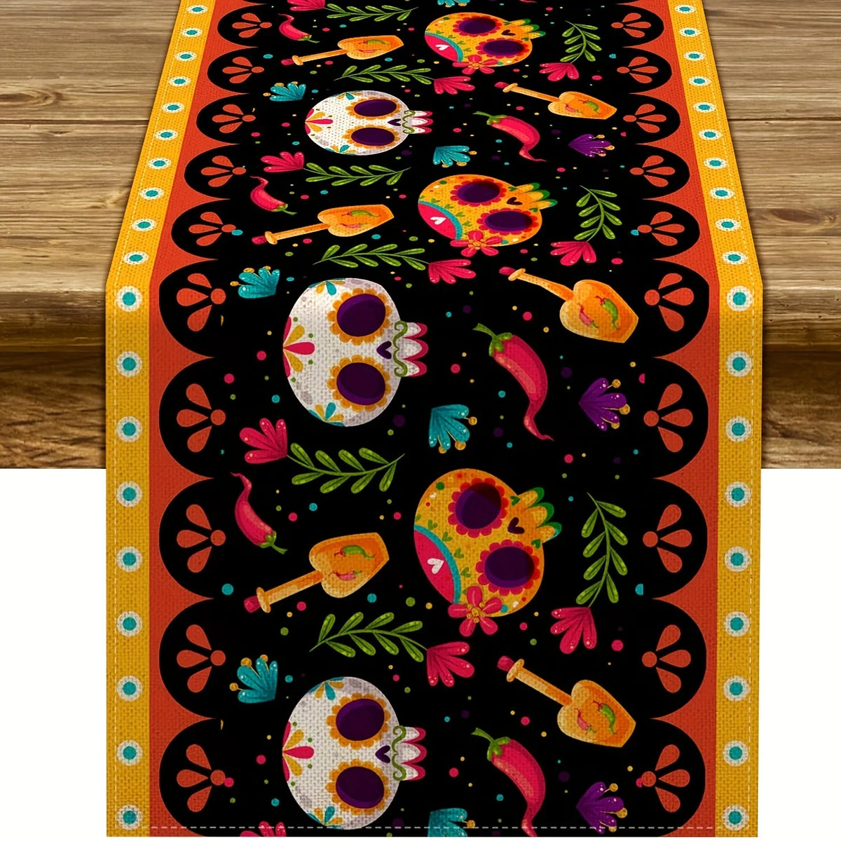 A vibrant Day of the Dead sugar skull linen table runner featuring colorful skulls and floral patterns on an orange backgroun
