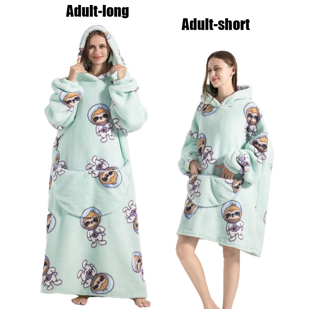 A light mint green adult-long plush fleece blanket hoodie with a graphic print of a person wearing a hood.