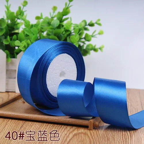 Rolls of blue satin ribbon for gift wrapping and DIY crafts