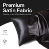A close-up of a black satin fabric pillowcase showing its smooth texture and breathable, soft finish.