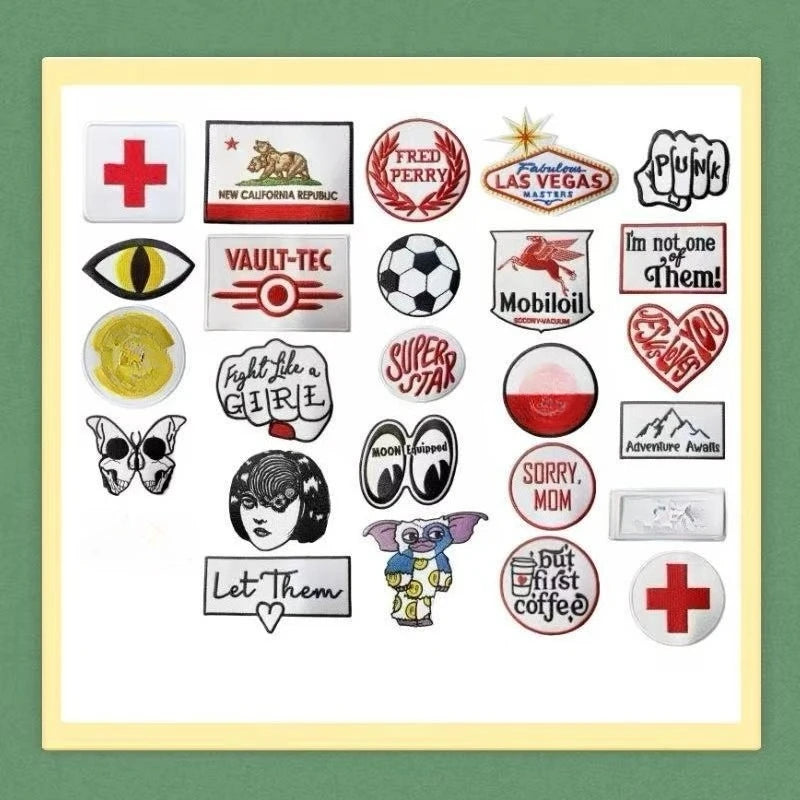 A collection of embroidered iron-on tactical patches featuring various designs like medical crosses, animal heads, and text.